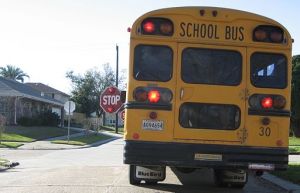 A school bus stops, via Wikimedia Commons