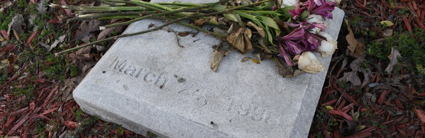 Flowers on marker at Westside Middle School Memorial Garden